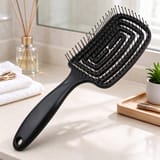 Cepillo para cabello flexible que desenreda y masajea