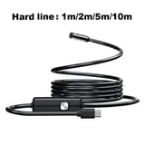 Cable endoscópico negro enrollado en espiral con la caja de control y la punta de cámara levantada, y el conector USB-C a la vista.