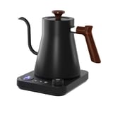 Tetera eléctrica de color negro mate con mango de aspecto de madera sobre su base.
