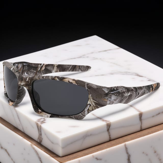 Gafas de sol polarizadas con montura envolvente deportiva